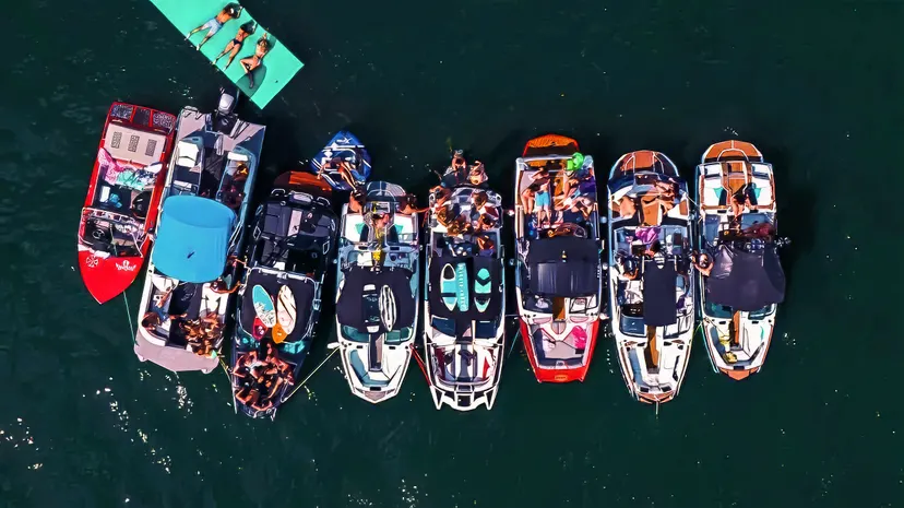 Overhead view of boats tied together on Candlewood Lake with a floating mat alongside.