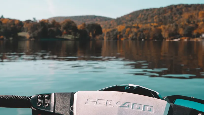 Sea-Doo handlebars with Candlewood Lake and autumn trees in the background.